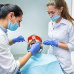 patient undergoing oral pathology evaluation during a comprehensive dental examination